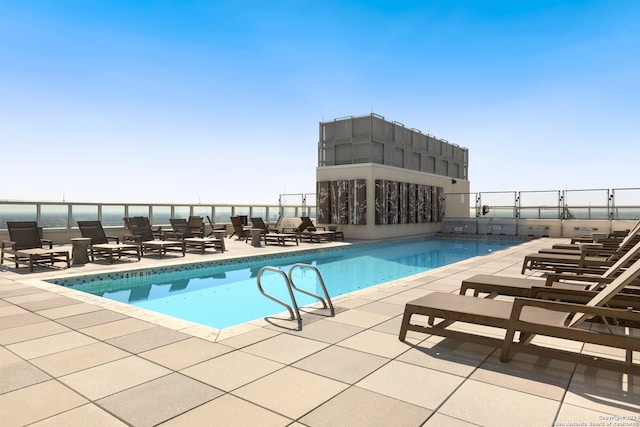 view of pool featuring a patio