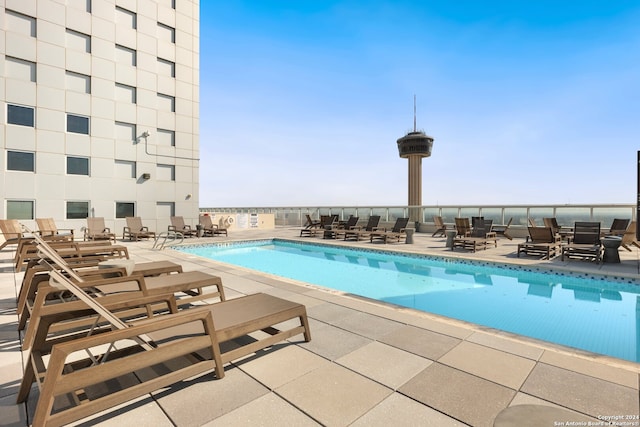 view of swimming pool with a patio