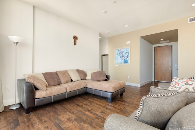 living room featuring dark wood-type flooring