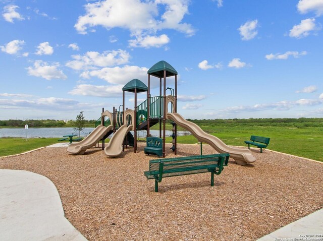 view of playground featuring a water view