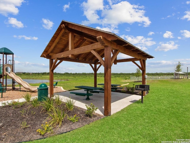 view of community featuring a playground, a gazebo, and a yard