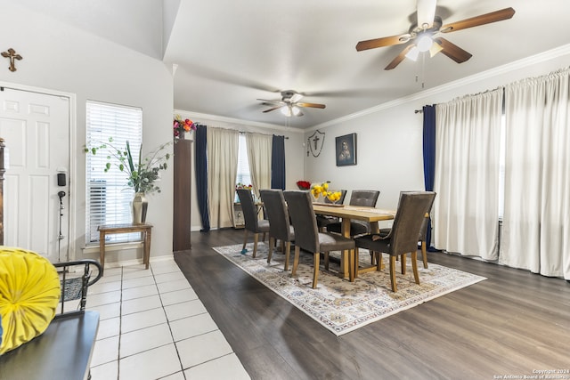 dining space featuring crown molding, tile patterned flooring, and ceiling fan