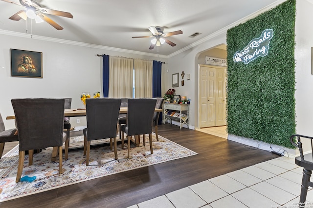 dining space with ceiling fan, wood-type flooring, and crown molding