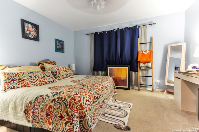 bedroom featuring ceiling fan and light colored carpet