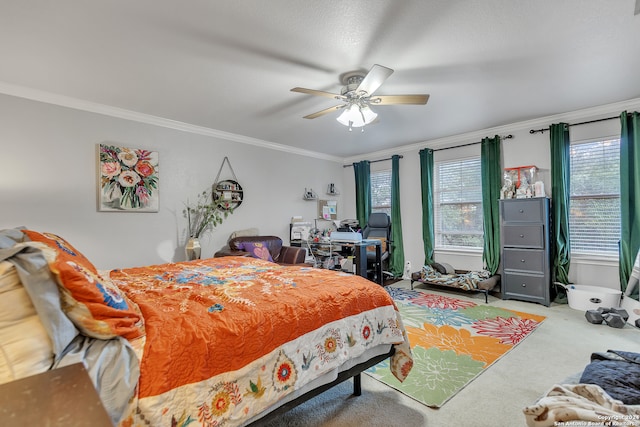 bedroom featuring ceiling fan, ornamental molding, and carpet