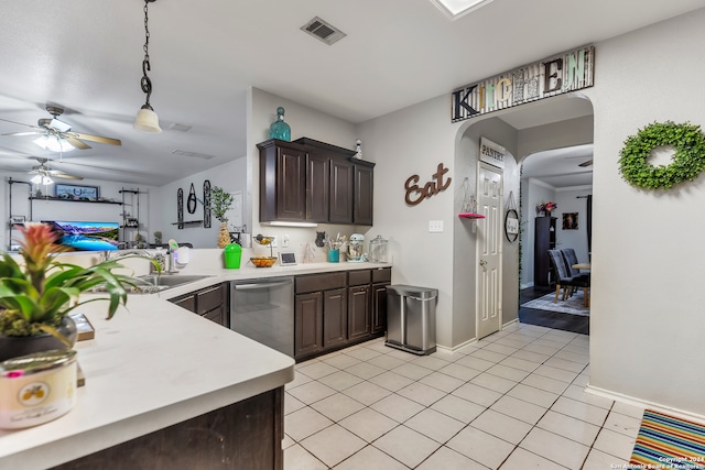 kitchen featuring dark brown cabinets, stainless steel dishwasher, light tile patterned floors, and ceiling fan