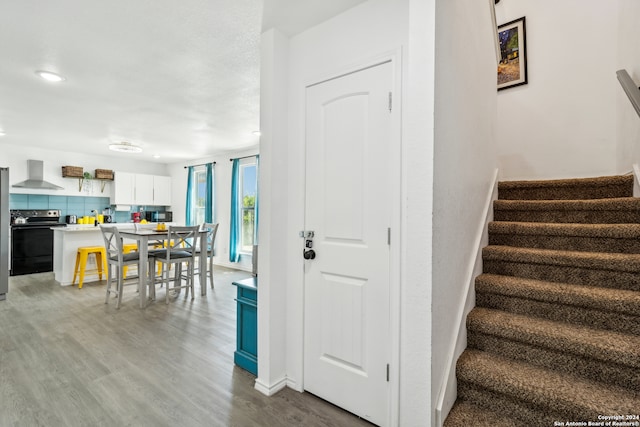 staircase featuring hardwood / wood-style floors