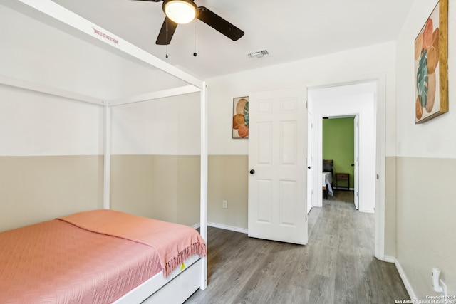 bedroom with ceiling fan and light hardwood / wood-style floors