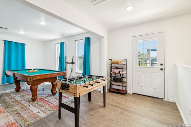 game room with light hardwood / wood-style flooring and pool table