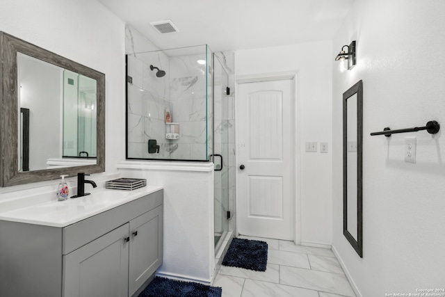 bathroom with an enclosed shower and vanity