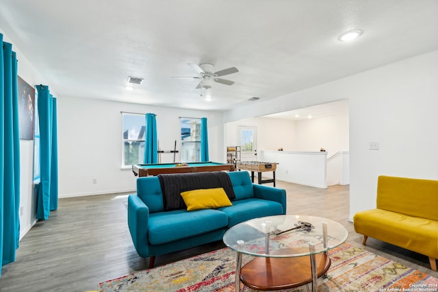 living room with pool table, ceiling fan, light hardwood / wood-style floors, and a healthy amount of sunlight