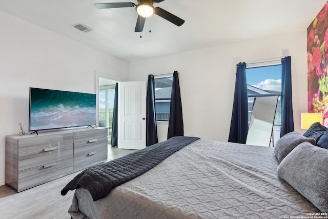 bedroom featuring ceiling fan and light hardwood / wood-style floors