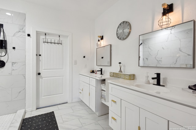 bathroom featuring vanity and tiled shower