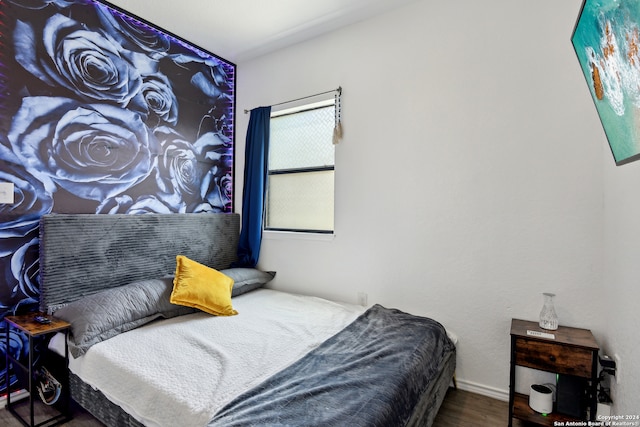 bedroom featuring wood-type flooring