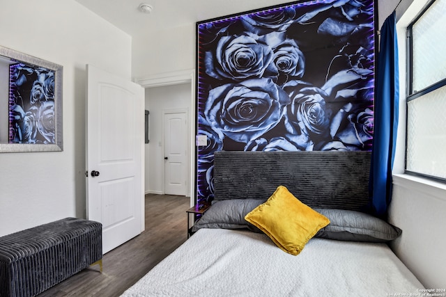 bedroom featuring dark hardwood / wood-style flooring