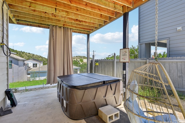 view of patio with a hot tub