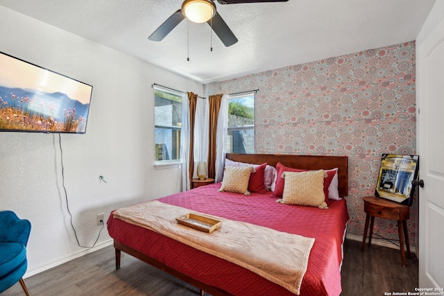 bedroom featuring dark wood-type flooring and ceiling fan