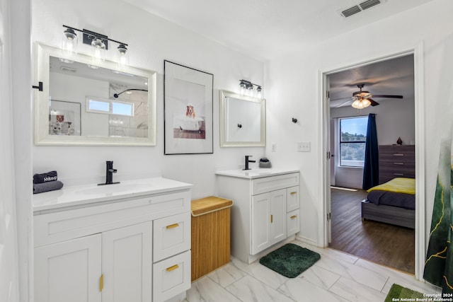 bathroom with ceiling fan, walk in shower, wood-type flooring, and vanity