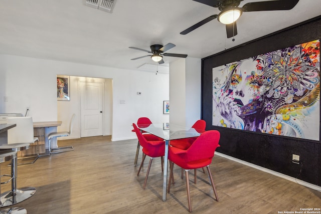 dining area featuring ceiling fan and wood-type flooring