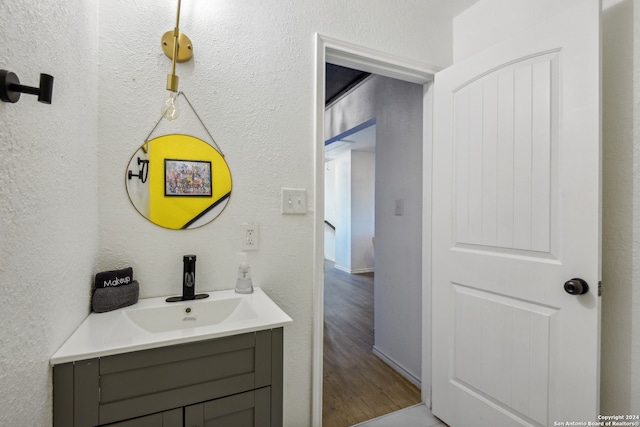 bathroom featuring vanity and hardwood / wood-style flooring