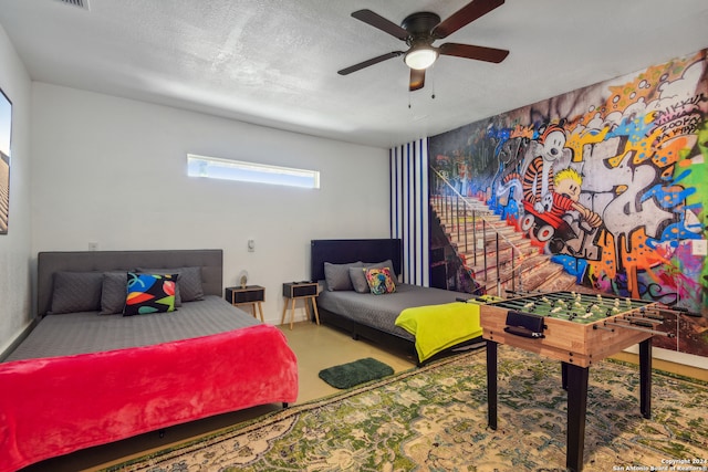 bedroom featuring a textured ceiling and ceiling fan