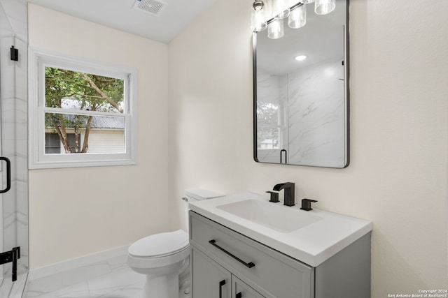 bathroom featuring vanity, toilet, and tile patterned flooring