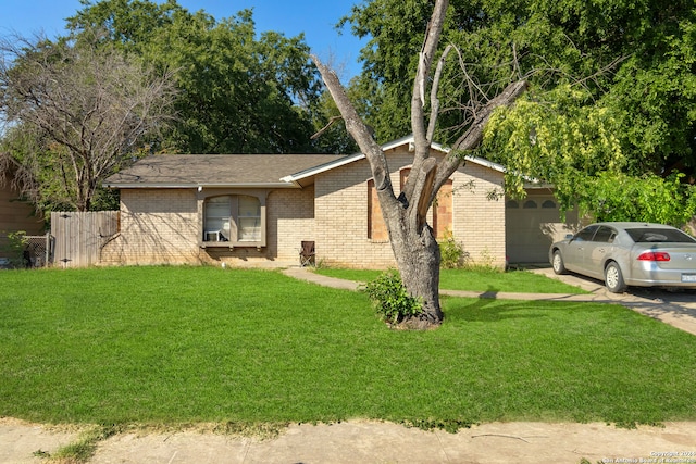 ranch-style house with a front lawn and a garage