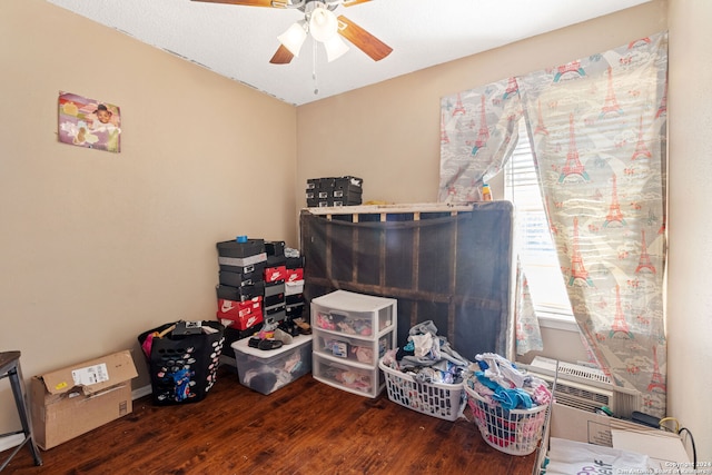 miscellaneous room featuring ceiling fan and hardwood / wood-style floors