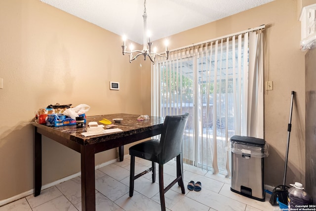 tiled dining room featuring an inviting chandelier