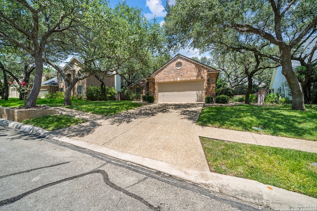 view of front facade with a garage and a front lawn