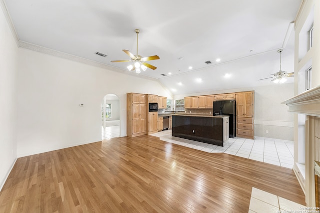 unfurnished living room with ceiling fan, crown molding, light wood-type flooring, and high vaulted ceiling