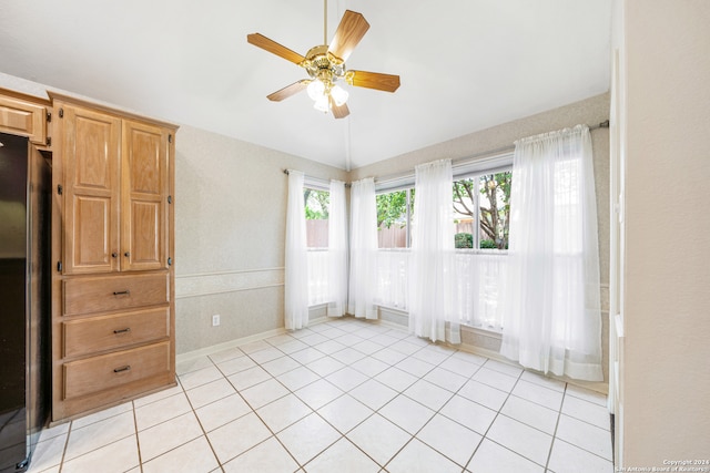 interior space with ceiling fan and light tile patterned floors