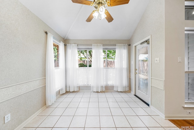 interior space with ceiling fan and vaulted ceiling