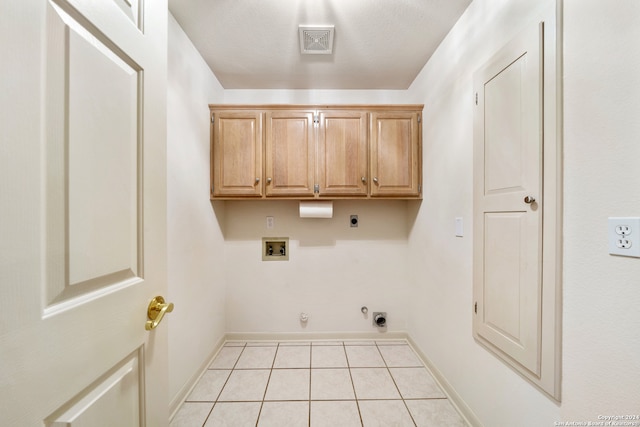 laundry area with hookup for an electric dryer, cabinets, light tile patterned floors, gas dryer hookup, and washer hookup