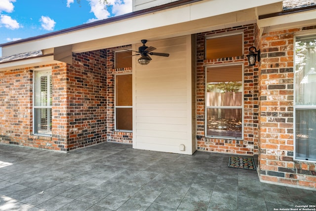 exterior space with ceiling fan