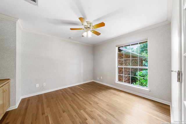 unfurnished room featuring ceiling fan, light hardwood / wood-style flooring, and ornamental molding