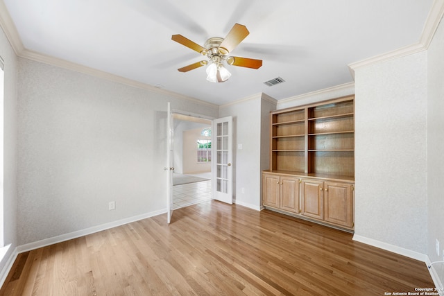 interior space featuring ceiling fan, light hardwood / wood-style flooring, french doors, and crown molding