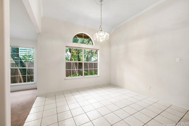 spare room with a notable chandelier, crown molding, vaulted ceiling, and light tile patterned floors