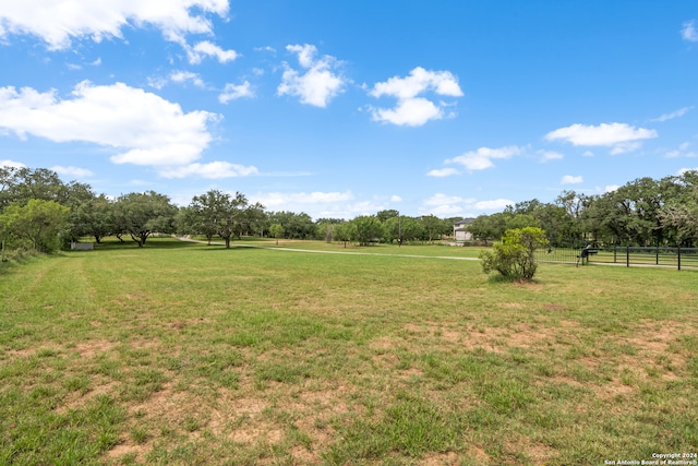 view of yard with a rural view