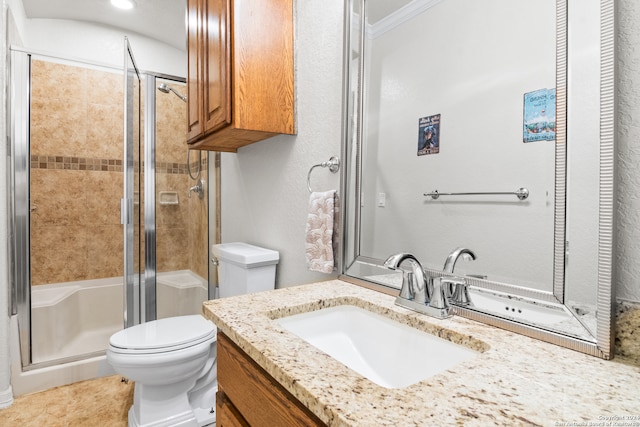 bathroom featuring toilet, ornamental molding, tile patterned floors, a shower with door, and vanity