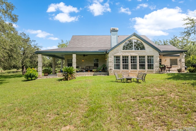 back of house with ceiling fan, a patio, and a yard