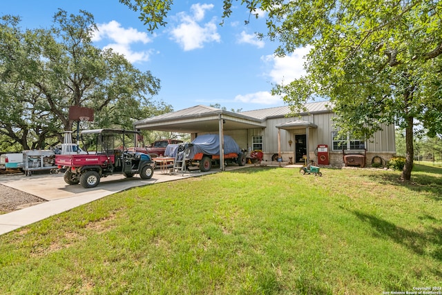 view of front facade with a carport and a front yard