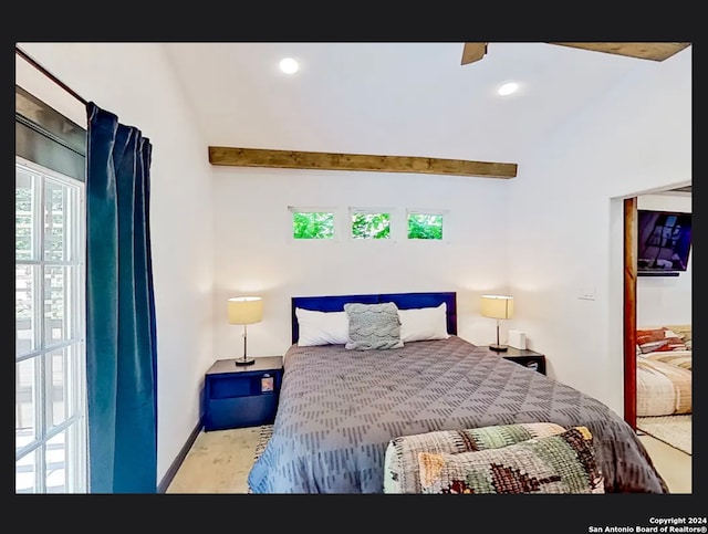 bedroom with lofted ceiling, ceiling fan, and multiple windows