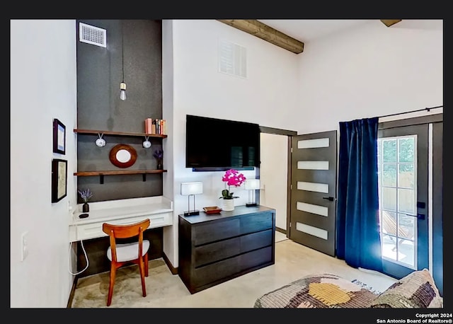 bedroom with a high ceiling and beamed ceiling