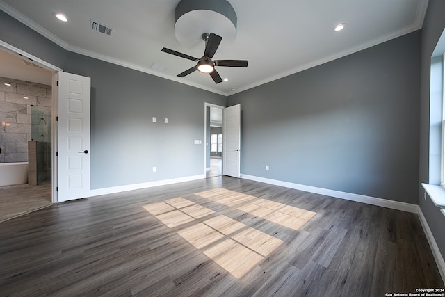 spare room with ceiling fan, wood-type flooring, tile walls, and ornamental molding