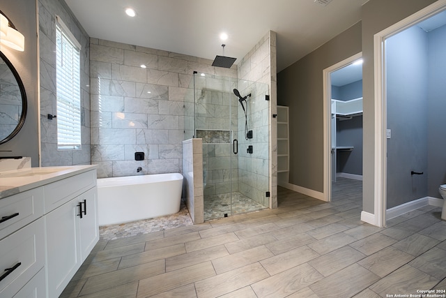 full bathroom featuring shower with separate bathtub, vanity, tile patterned flooring, and a healthy amount of sunlight