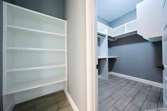 spacious closet with light hardwood / wood-style floors