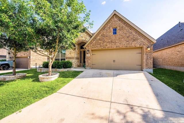 view of front of property with a garage and a front lawn