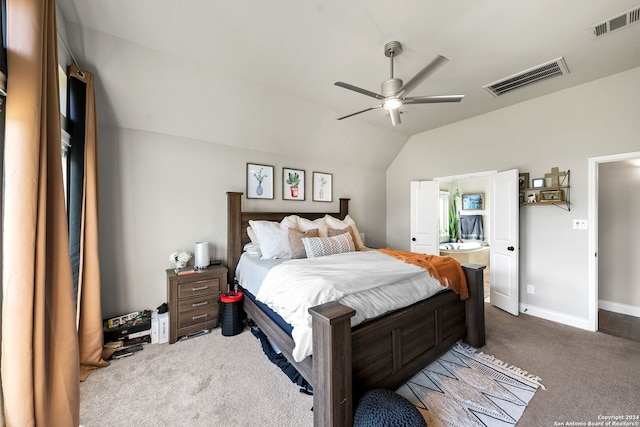 carpeted bedroom with lofted ceiling, connected bathroom, and ceiling fan