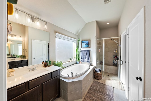 bathroom featuring shower with separate bathtub, tile patterned floors, vanity, and lofted ceiling